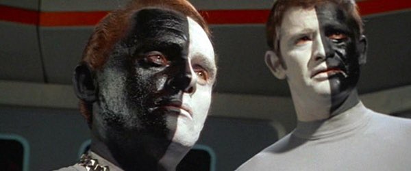 Famous screenshot from Star Trek: The Original Series, showing the warring aliens with opposite half-black, half-white faces.